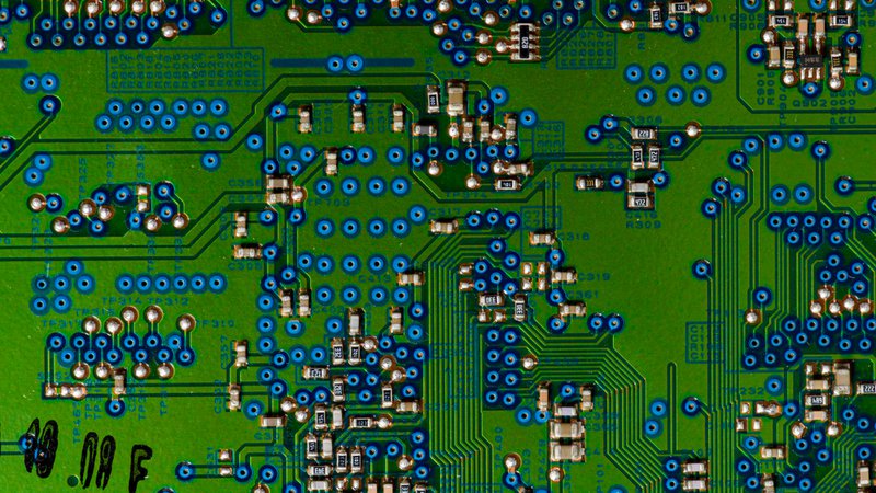 The image shows a mixed-technology PCB.