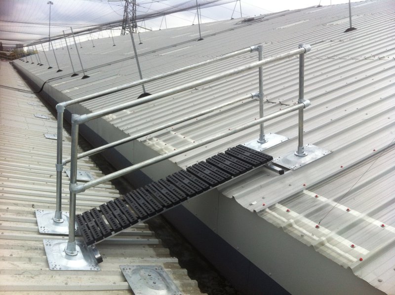 NextGen Continuous Railing Ramp installed on a standing seam roof for safe worker access