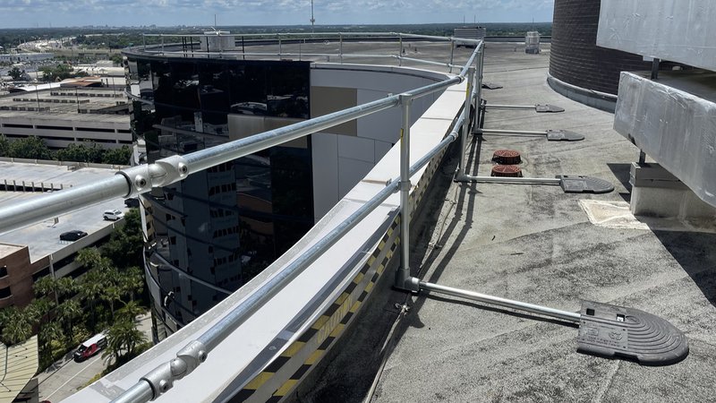 A rooftop guardrail system set up