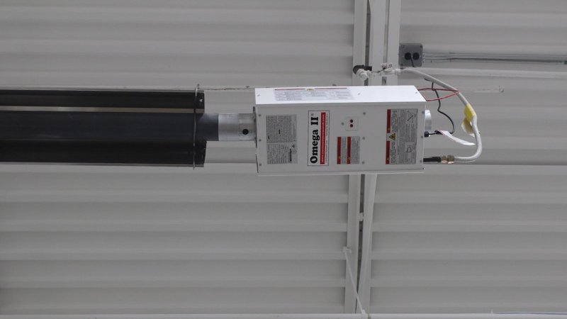 A radiant heater in a large industrial building