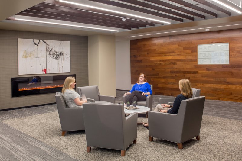 This photo features a lounge with an accent wall made of Sapele wood 