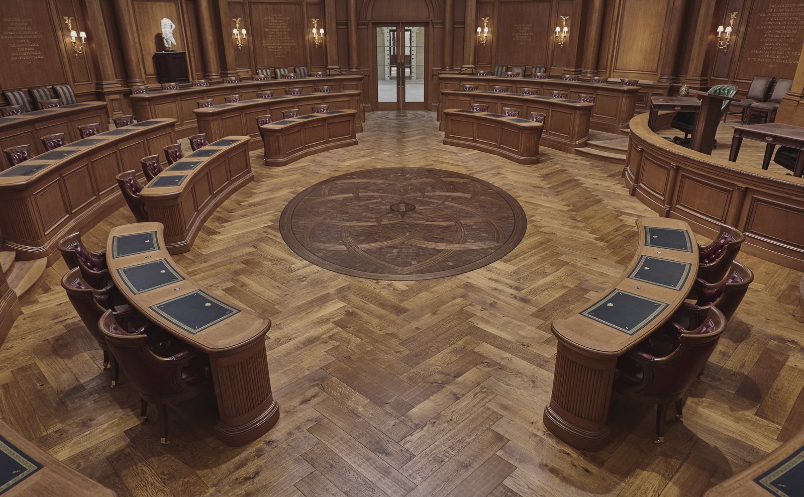 This photo shows a courtroom with a custom medallion This photo shows a courtroom with a custom medallion