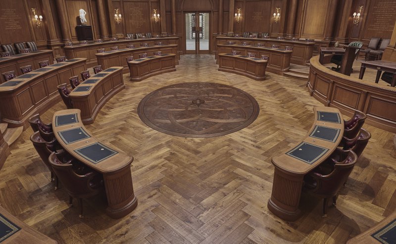 This photo shows a courtroom with a custom medallion