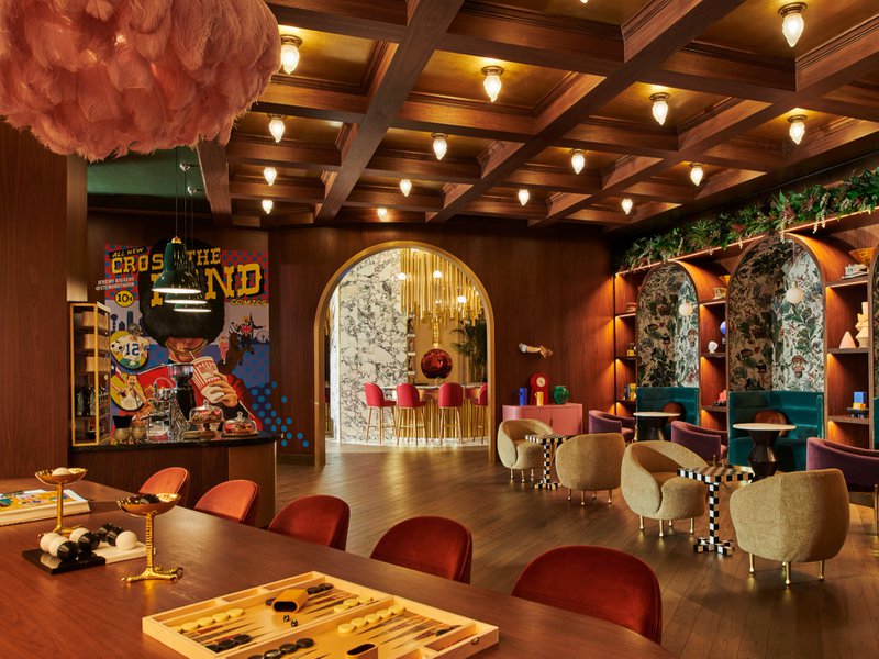 This photo features a hotel lounge using texas post oak flooring