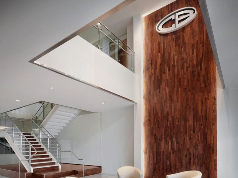 Wooden statement wall that contrasts against the minimalist design of the lobby Wooden statement wall that contrasts against the minimalist design of the lobby
