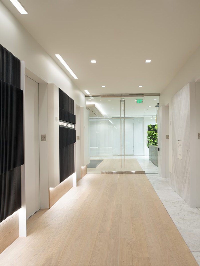 The image shows a corporate office using prime grade European White Oak flooring
