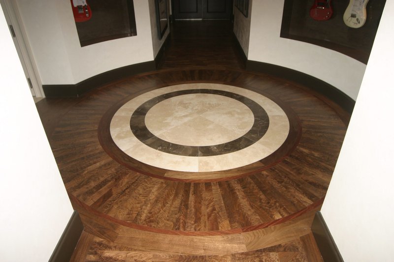 This photo focuses on a custom showroom flooring done using custom cut wood