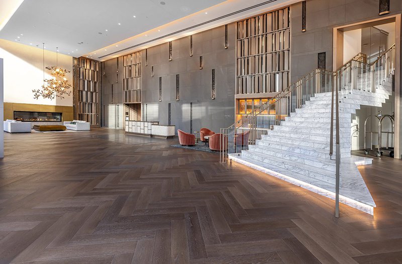 This photo features a plaza lounge that uses hardwood flooring