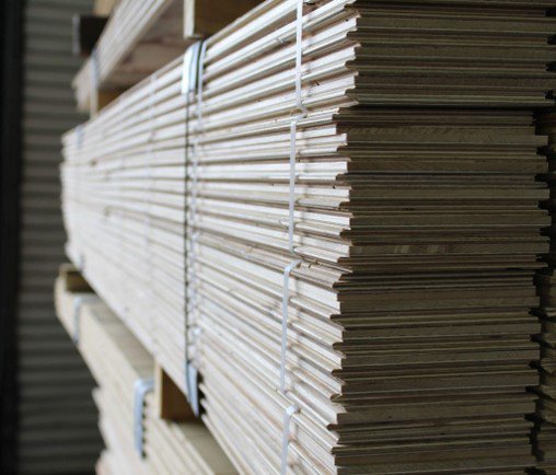 An image showing stacks of engineered flooring.