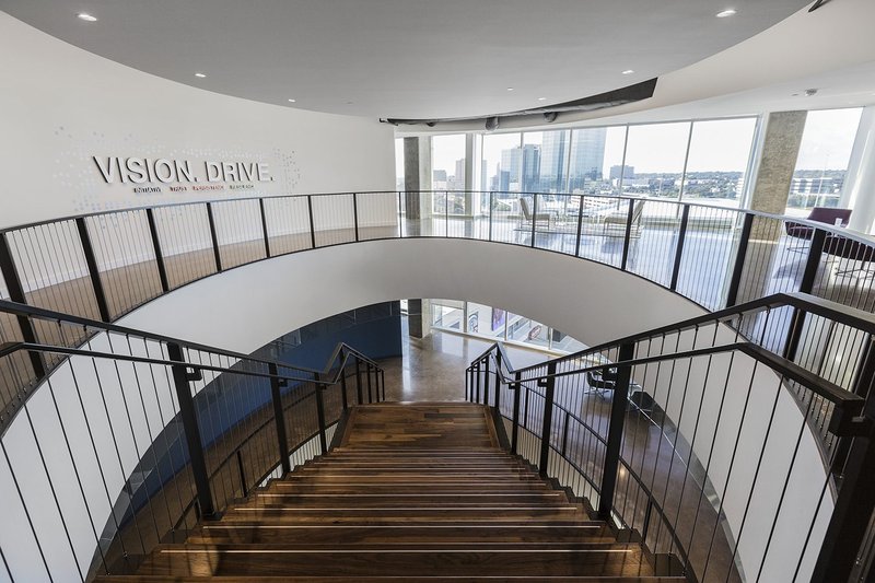 This photo features walnut wood flooring and staircases at an office