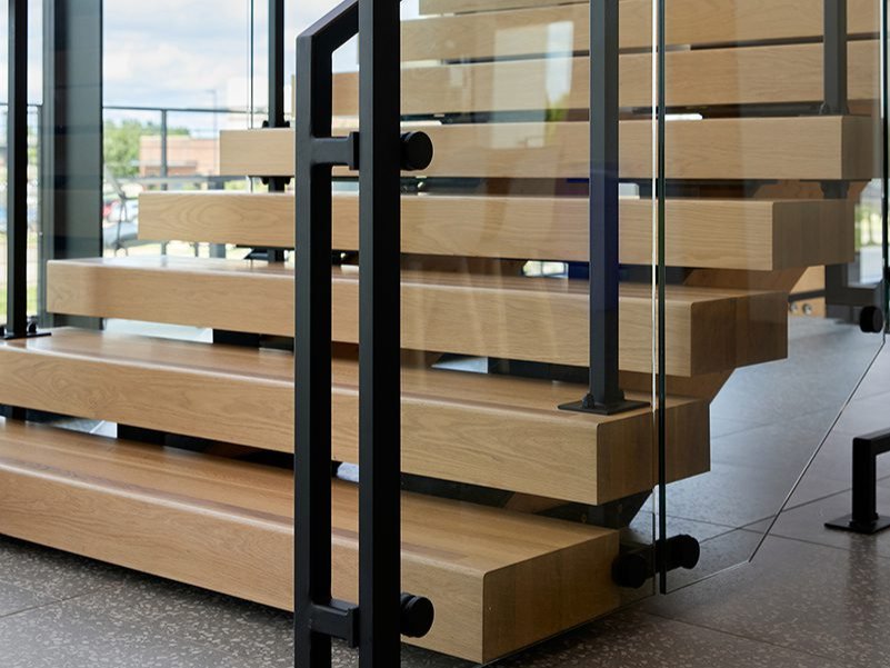 A stairway that prominently showcases Woodwright's 5' thick custom edge grain White Oak wood stair treads. A stairway that prominently showcases Woodwright's 5' thick custom edge grain White Oak wood stair treads.