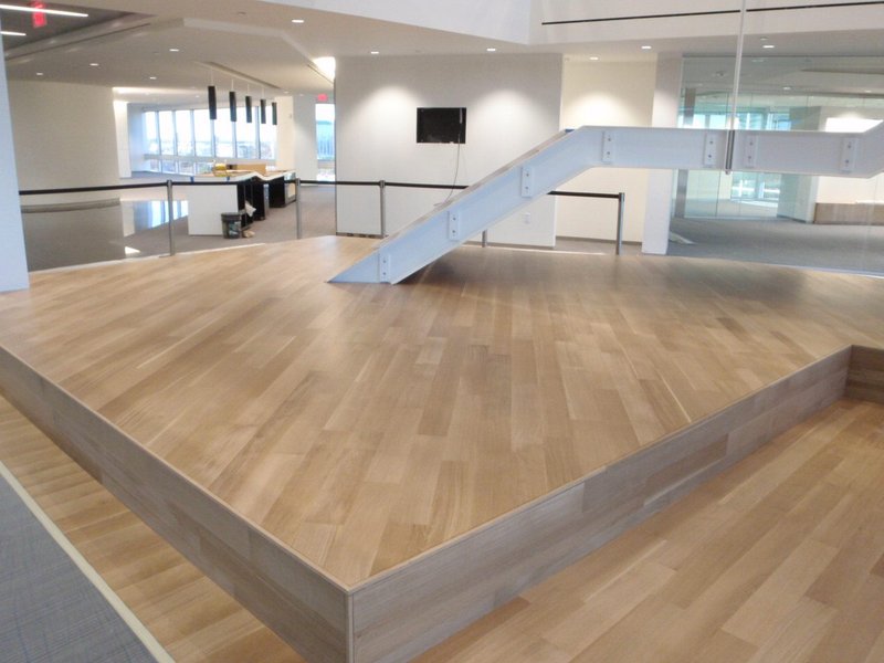 Main staircase at a commercial establishment using engineered white oak stairs and flooring