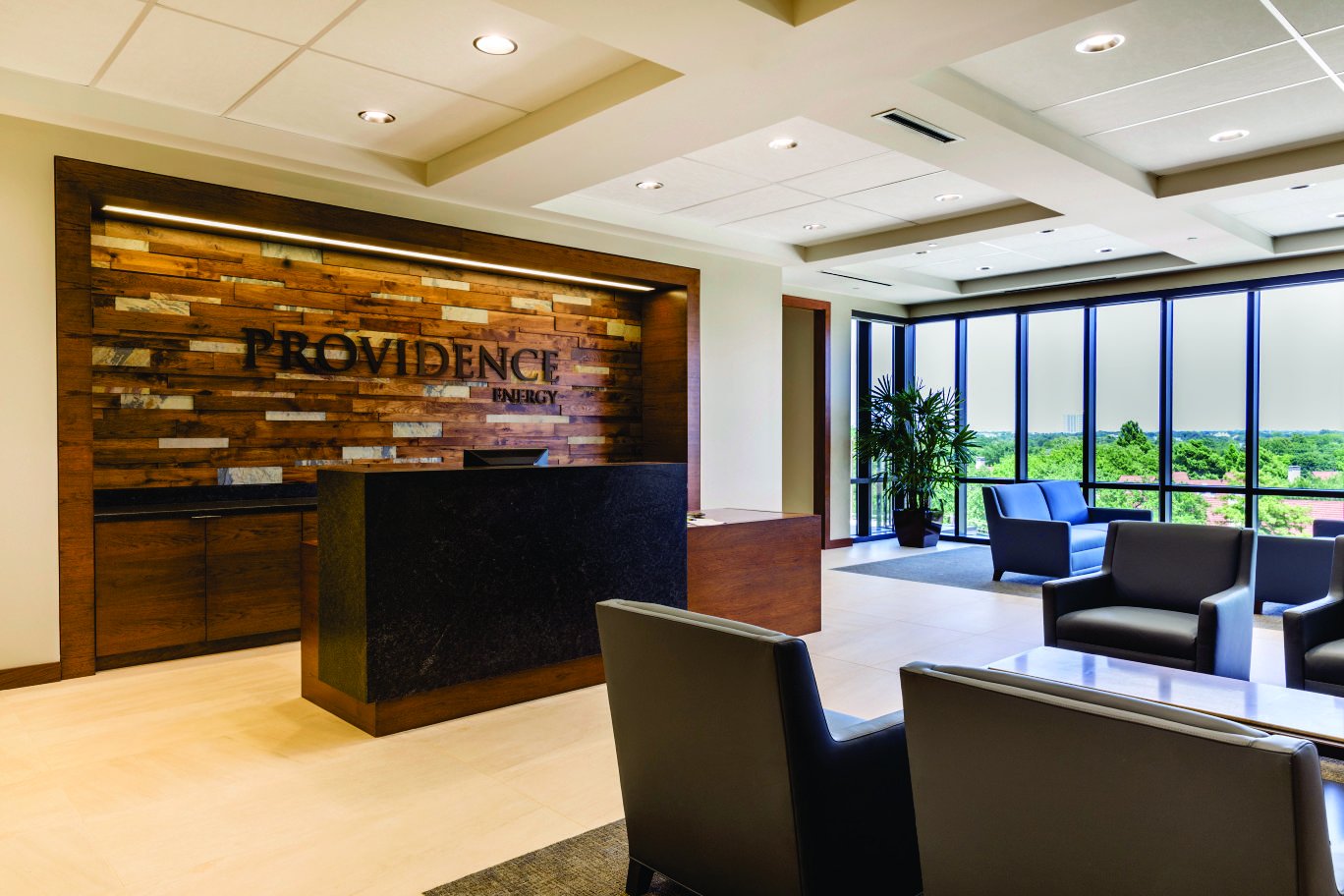 An office lobby that uses a wood wall to contrast the glass and tiles An office lobby that uses a wood wall to contrast the glass and tiles