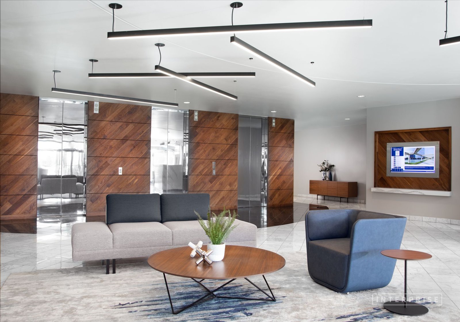 The image shows walnut wood flooring installed on a wall panel
