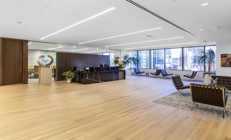 This photo features an office lobby with durable white oak flooring