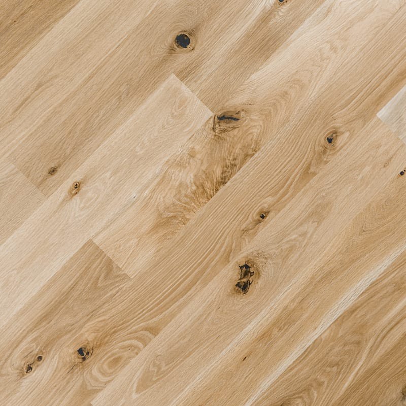 The image shows a top down view of a rustic grade white oak wood flooring