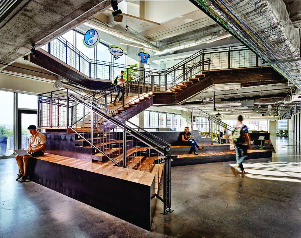 This photo features a staircase that also doubles as seating spaces and collaborative hubs