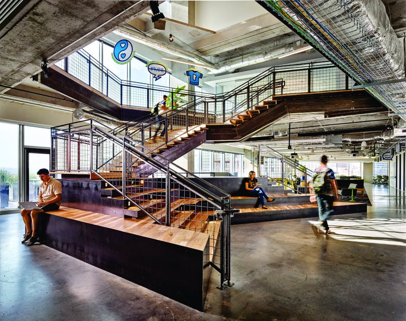 This photo features a staircase that also doubles as seating spaces and collaborative hubs