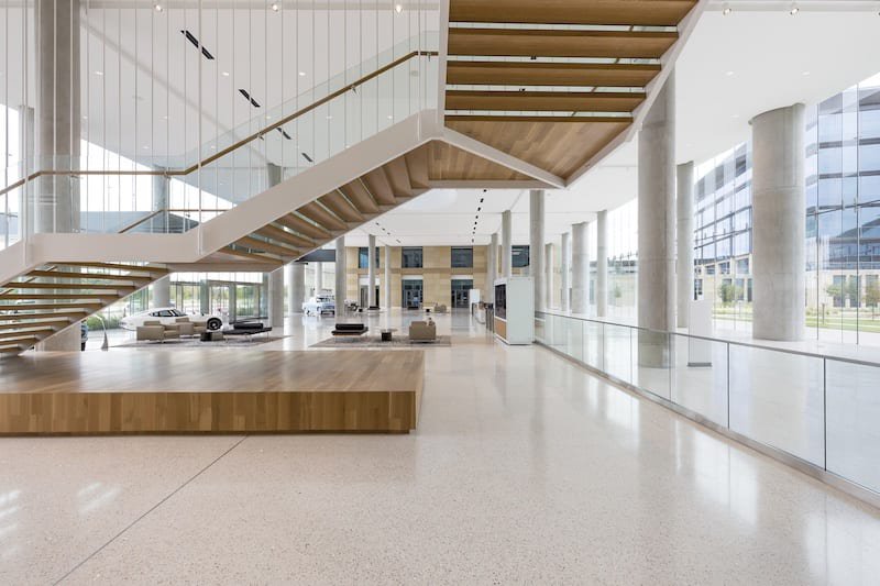 This photo features a monumental floating staircase with glass details. 