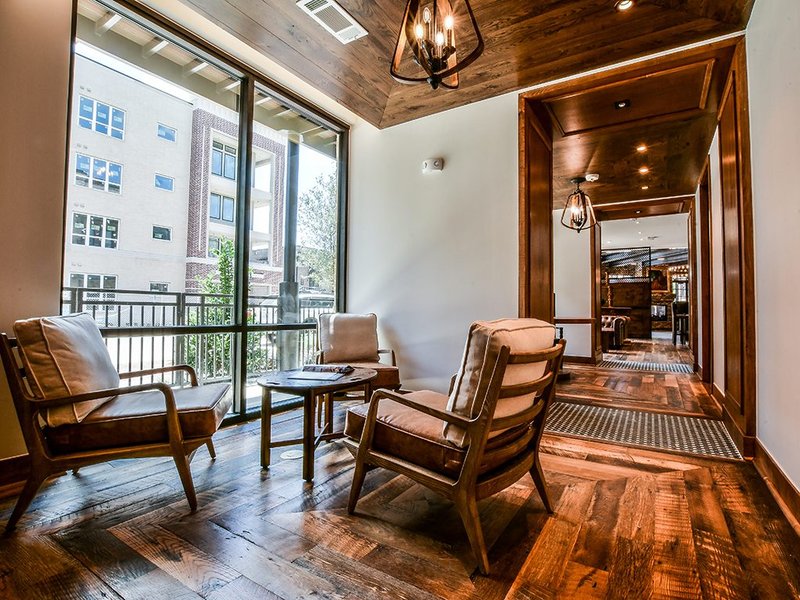 A lounge with matching patterns for the flooring and ceiling