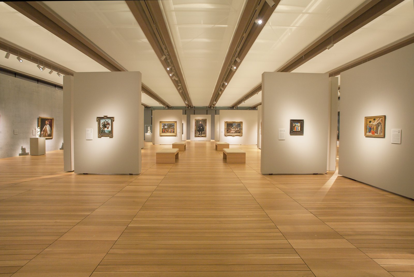 This photo showcases a gallery with solid hardwood flooring 