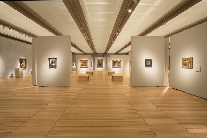This photo showcases a gallery with solid hardwood flooring 