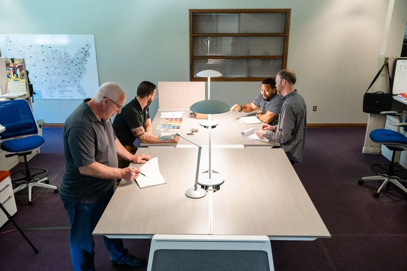 An office desk with pendant lights and a task light