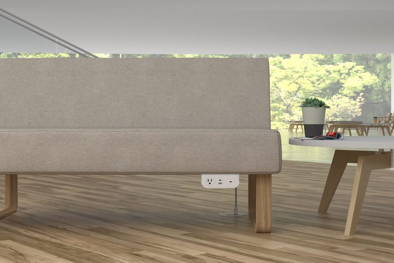 This photo features an under-mount power unit placed under a sofa