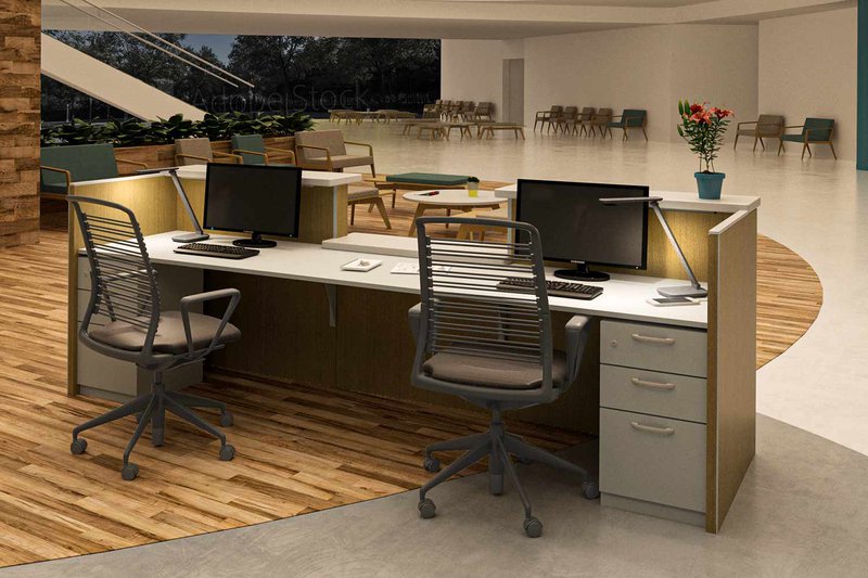 The image shows desk lights being used on two workstations to give its users flexibility with their lighting needs.