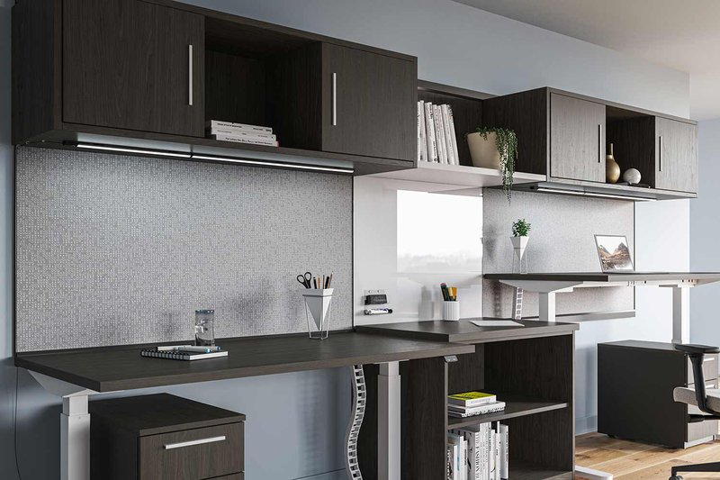 The image shows a few desks and drawers installed at an office workspace