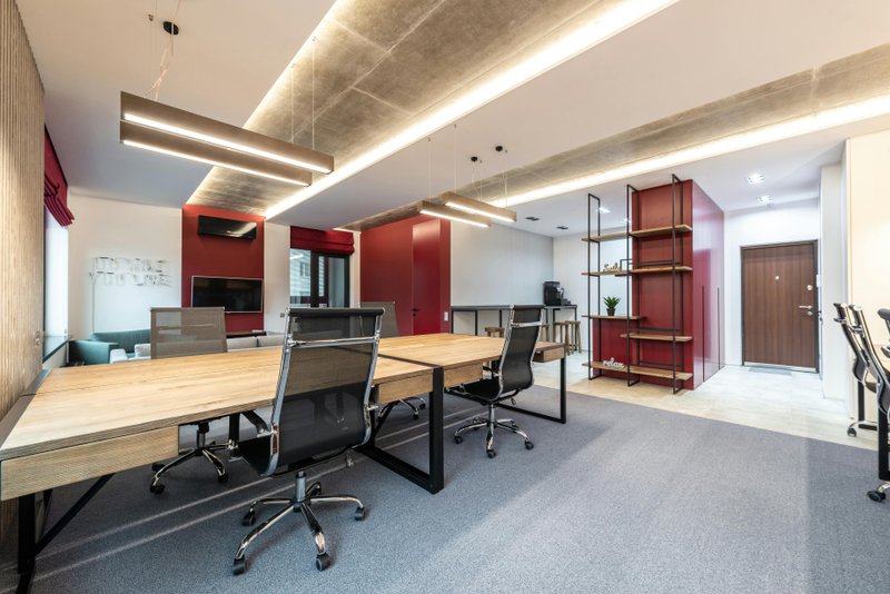 This photo features an office space that uses different layers of lighting
