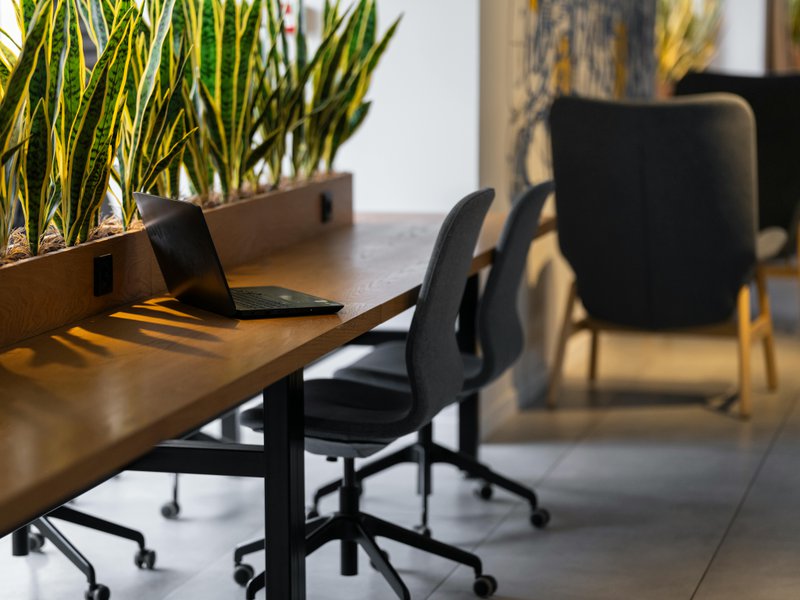 This photo features an office desk with integrated power outlets for a sleek profile