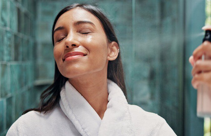 Woman using facial mist