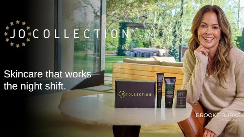 TV Personality Brook Burke posing with Jo Collection skin care set