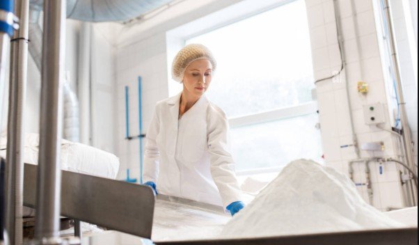 a woman working in mill services