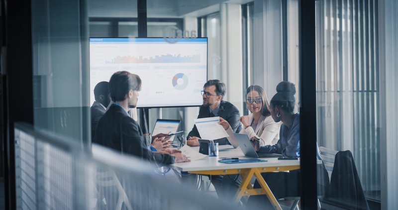 Business team reviewing digital performance metrics for field service operations