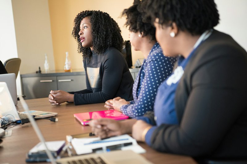 a woman discussing in a group. operational efficiency