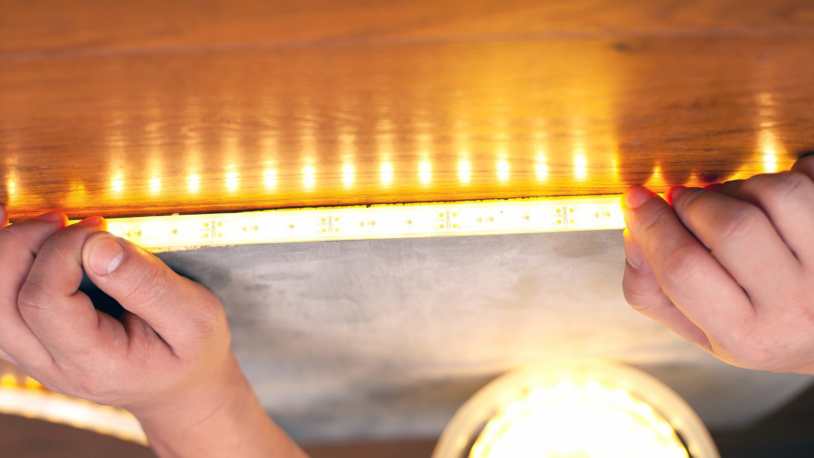 Recessed linear lighting integrated into a clean modern architectural ceiling
