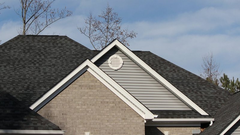 Coordinated roofing and gutters installed to highlight exterior Curb Appeal Ideas.