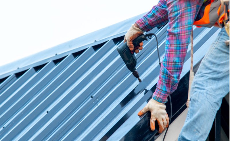 Fastening metal panel seams during metal roofing installation