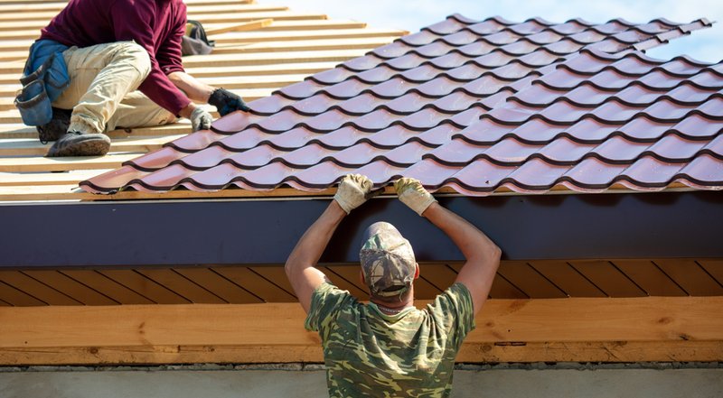 plymouth roofing company installing asphalt shingles
