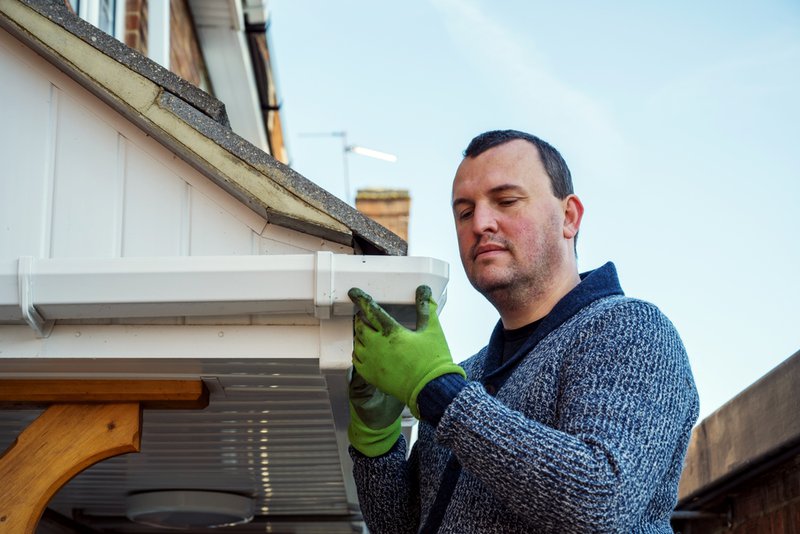 Gutter replacement during spring to prevent water damage from rain