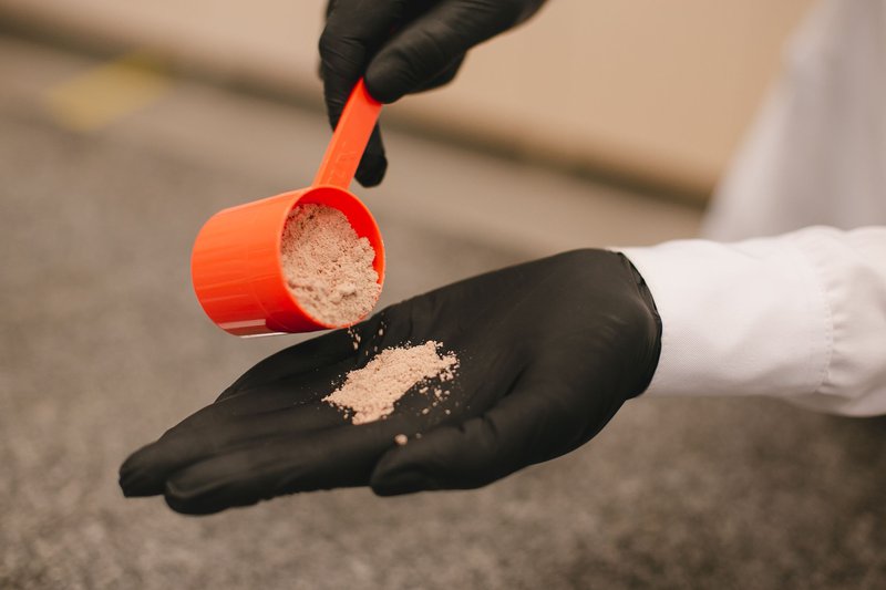 This photo shows superfood powder being tested by a lab technician