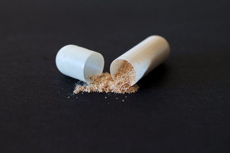 This photo features vitamin e powder from an open capsule