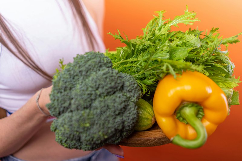 This photo features vegetables that are used to create plant-based gut health supplements.
