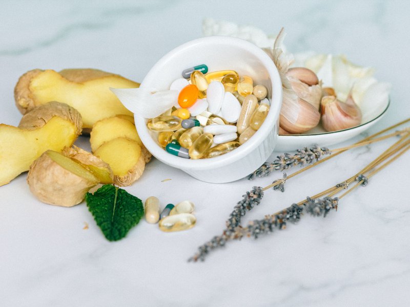 This photo features various plant-based supplements on a table.