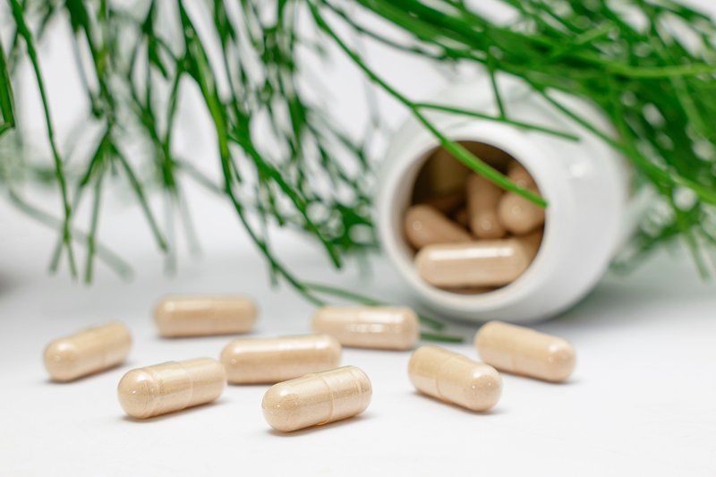 This photo shows the best supplements for gut health laid out on a table