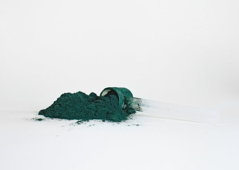This photo features a functional ingredient in powder form spilling out of a scoop