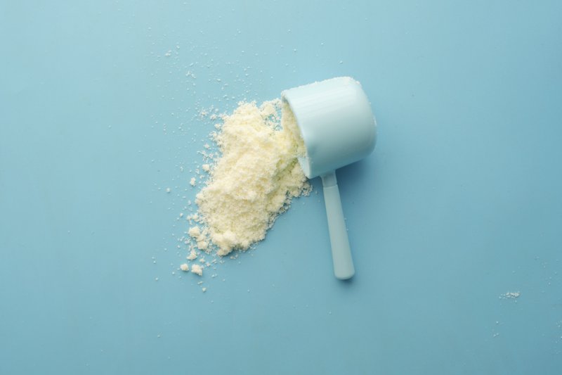 This photo features a powdered ingredient spilling out of a scoop