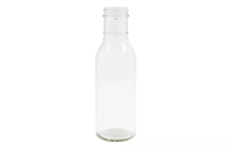 A clear glass ring neck bottle for barbecue sauce and other things.